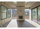 Charming covered patio features a brick fireplace, skylights and sliding glass doors, perfect for outdoor relaxation at 17364 Pinellas Ave, Westfield, IN 46074