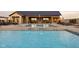 Beautiful community pool area with fountains and comfortable lounge chairs for residents' enjoyment at 17364 Pinellas Ave, Westfield, IN 46074