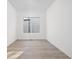 Bright room featuring sleek flooring, a large window providing ample light, and neutral walls at 17364 Pinellas Ave, Westfield, IN 46074