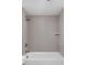 Modern bathroom featuring a bathtub and shower combo featuring grey tile and sleek fixtures at 17364 Pinellas Ave, Westfield, IN 46074