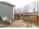 View of a wooden back deck with outdoor furniture overlooking a grassy yard and storage shed at 1820 E Maryland St, Indianapolis, IN 46201