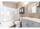 Bathroom featuring a shower-tub combo and vanity at 1820 E Maryland St, Indianapolis, IN 46201