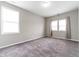 Bright bedroom with neutral walls and plush carpet at 1820 E Maryland St, Indianapolis, IN 46201