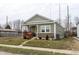 Quaint single-Gathering home showcasing a cozy front porch and well-maintained lawn at 1820 E Maryland St, Indianapolis, IN 46201