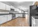 Modern kitchen featuring white cabinetry, stainless appliances, and stylish countertops at 1820 E Maryland St, Indianapolis, IN 46201