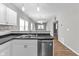 Well-lit kitchen with stainless steel dishwasher and eat-in bar overlooking the rest of the home at 1820 E Maryland St, Indianapolis, IN 46201