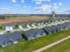 Aerial view showcasing homes in a neighborhood, highlighting lush green lawns and community spaces at 19568 Astoria Ave, Sheridan, IN 46069