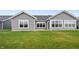 Spacious backyard featuring new sod, an expansive patio, and modern gray siding at 19568 Astoria Ave, Sheridan, IN 46069