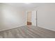 This bedroom features neutral walls and soft gray carpet, with an open doorway to another room at 19568 Astoria Ave, Sheridan, IN 46069