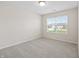 Simple bedroom features a window with blinds and neutral carpet, offering a blank canvas for personalization at 19568 Astoria Ave, Sheridan, IN 46069