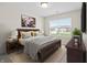 Cozy bedroom with a comfortable bed, soft rug, and a large window allowing for plenty of natural light at 19568 Astoria Ave, Sheridan, IN 46069