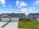 Charming home with well-maintained lawn, two-car garage, and stone accents at 19568 Astoria Ave, Sheridan, IN 46069