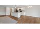 Bright kitchen features white cabinets, granite countertops, stainless appliances, and a large island at 19568 Astoria Ave, Sheridan, IN 46069