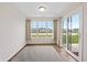 Bright living room with slider door, large windows and an open floor plan at 19568 Astoria Ave, Sheridan, IN 46069