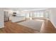 Bright living space showcasing a kitchen island and open layout at 19568 Astoria Ave, Sheridan, IN 46069
