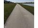 Well-maintained community path runs alongside a lake, perfect for walking, jogging, or biking at 19568 Astoria Ave, Sheridan, IN 46069