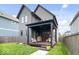 Backyard featuring a covered patio, seating, and a well-maintained lawn perfect for outdoor enjoyment at 2026 Alvord St, Indianapolis, IN 46202