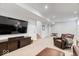 Finished basement features a large TV, neutral carpet and comfortable seating at 2026 Alvord St, Indianapolis, IN 46202