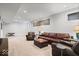 Spacious finished basement featuring recessed lights, and comfortable leather seating at 2026 Alvord St, Indianapolis, IN 46202