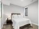 Cozy bedroom with natural light, neutral carpet, and a comfortable queen bed at 2026 Alvord St, Indianapolis, IN 46202
