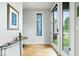 Bright and modern entryway with natural light, wood floors, and stylish accents at 2026 Alvord St, Indianapolis, IN 46202