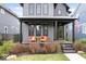 Inviting front porch with seating area, stylish decor, and attractive landscaping at 2026 Alvord St, Indianapolis, IN 46202
