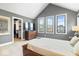 Spacious main bedroom features a walk-in closet, neutral walls, carpet flooring, and many windows at 2026 Alvord St, Indianapolis, IN 46202