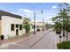 Street view featuring quaint storefronts, brick walkways, and vintage-style lighting creating a charming commercial atmosphere at 2026 Alvord St, Indianapolis, IN 46202