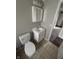This bathroom features a new vanity, toilet and medicine cabinet in a clean, classic design at 2032 Costello Dr, Anderson, IN 46011