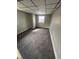 Neutral bedroom with plush gray carpet, a paneled ceiling, and a sunny window at 2032 Costello Dr, Anderson, IN 46011