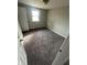 Cozy bedroom with neutral walls, new carpeting, and a bright window at 2032 Costello Dr, Anderson, IN 46011