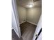 Functional laundry room with modern gray flooring offering ample space for appliances and storage at 2032 Costello Dr, Anderson, IN 46011