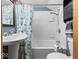 A sink and shower combination with seashell-themed shower curtain at 208 S Conger St, , IN 47272