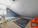 This is a bedroom with an accent wall, bed, and a window on the left at 208 S Conger St, , IN 47272