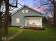 Charming house with a welcoming front porch and well-maintained lawn at 208 S Conger St, , IN 47272