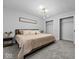 This is a bedroom with grey walls, 2 closets and a unique light fixture at 208 S Conger St, , IN 47272