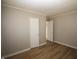 Bedroom with new flooring, fresh paint and two white doors at 2261 N Centennial St, Indianapolis, IN 46222