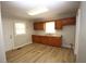 Kitchen featuring new laminate flooring and wooden cabinets at 2261 N Centennial St, Indianapolis, IN 46222