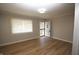 Inviting living room featuring new laminate flooring and a window for natural light at 2261 N Centennial St, Indianapolis, IN 46222