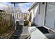 Back patio featuring a grill and gated fence area at 243 S 3Rd Ave, Beech Grove, IN 46107
