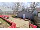 The backyard features a detached garage and a fire pit at 243 S 3Rd Ave, Beech Grove, IN 46107