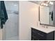 Modern bathroom with a walk-in shower, stylish tile, and sleek vanity at 243 S 3Rd Ave, Beech Grove, IN 46107