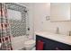 Bathroom with a shower and bathtub combo, decorative tile, vanity and storage at 243 S 3Rd Ave, Beech Grove, IN 46107