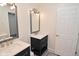 Bathroom featuring double vanities, mirrors and modern fixtures at 243 S 3Rd Ave, Beech Grove, IN 46107