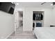 Bright bedroom featuring wood floors, a large closet, and modern entertainment system at 243 S 3Rd Ave, Beech Grove, IN 46107