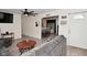 Open-concept living area with a view into the kitchen, featuring hardwood floors and neutral tones at 243 S 3Rd Ave, Beech Grove, IN 46107