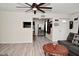 Open floor plan connecting the living room and kitchen, creating a cohesive and inviting space at 243 S 3Rd Ave, Beech Grove, IN 46107