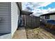 View of the side yard with a walkway and fenced area at 243 S 3Rd Ave, Beech Grove, IN 46107