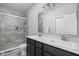 Bathroom featuring double sinks, modern fixtures, and a walk-in shower with tiled walls at 2556 Lamar Dr, Whitestown, IN 46075