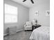 This bedroom offers a chair with a 'Relax' pillow, natural light, and a serene atmosphere at 2556 Lamar Dr, Whitestown, IN 46075